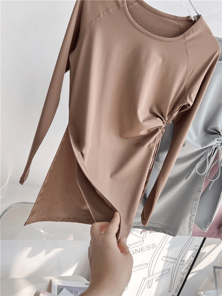 Sports waist drawstring top with slits in beige, showcasing elastic fitness design with full sleeves for women, product code SF0050.